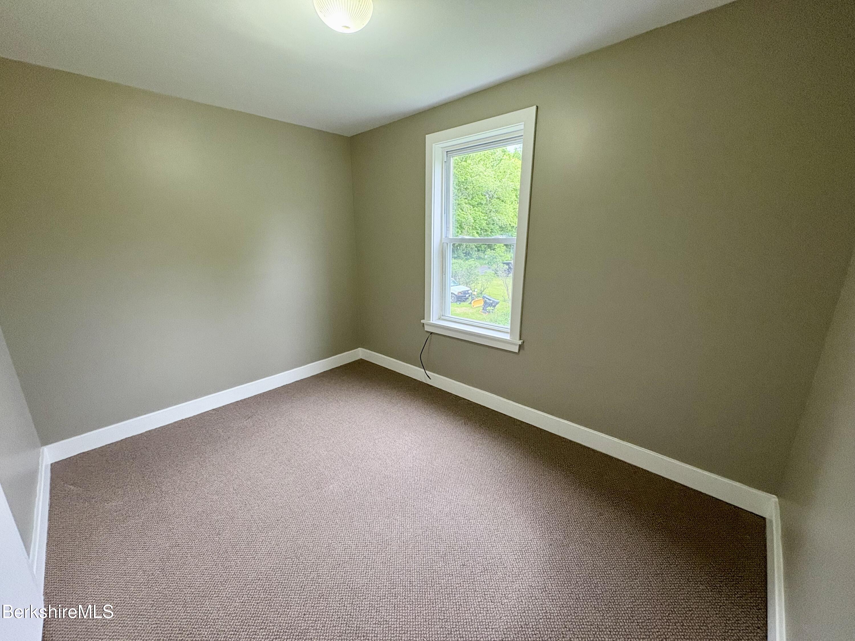 319 Old Columbia Street Adams, MA 01220 - Photo 8 of 15 an empty room with a window