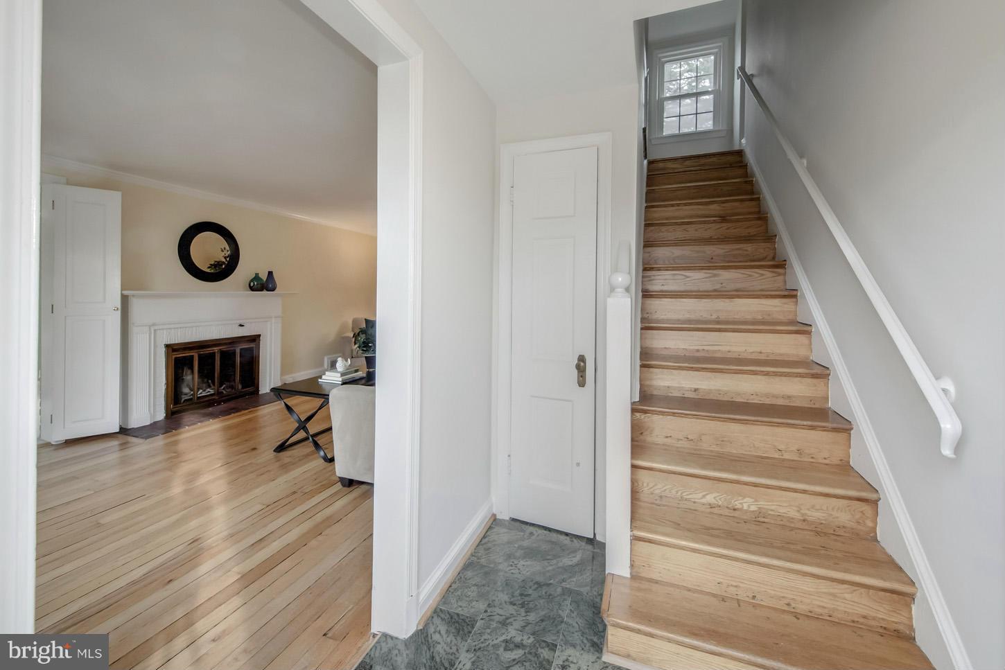 9521 Thornhill Road Silver Spring, MD 20901 - Photo 3 of 30 a view of a livingroom with wooden floor and staircase