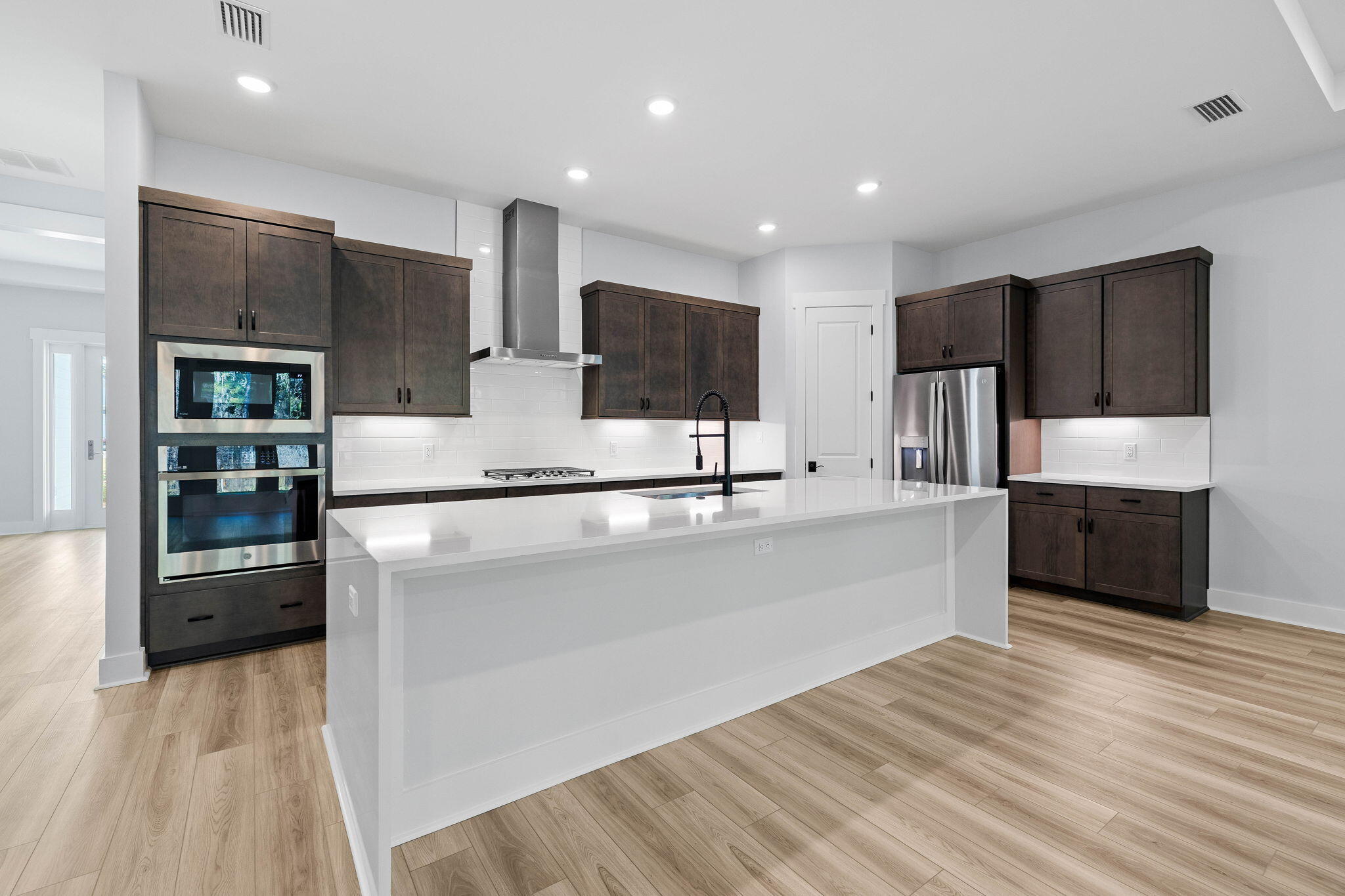 58 Ferndale Court Inlet Beach, FL 32461 - Photo 5 of 37 a large kitchen with stainless steel appliances a large counter top and a refrigerator