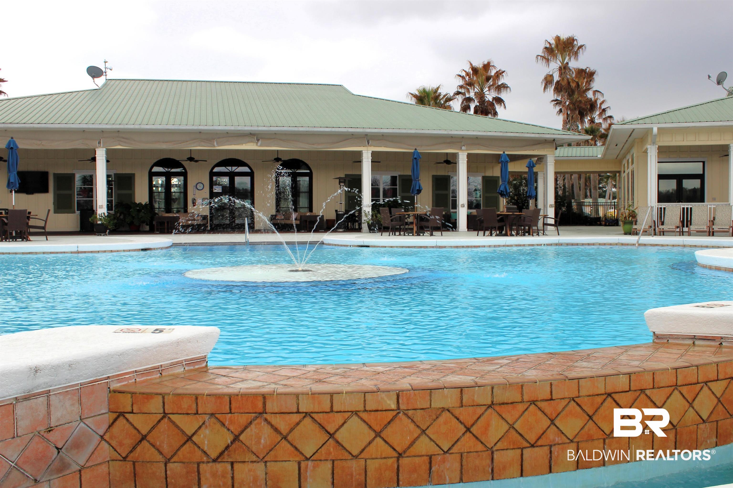 28114 Preserve Trail, Unit 190 Elberta, AL 36530 - Photo 42 of 69 Community pool with a patio and outdoor dining space