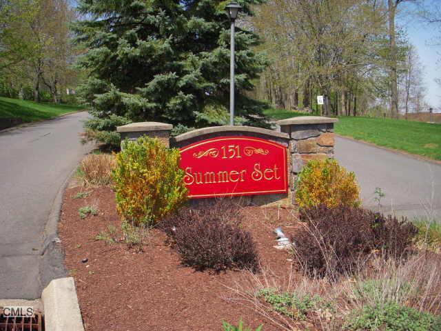 151 Shelter Rock Road, Unit 41 Danbury, CT 06810 - Photo 1 of 1 a sign that is sitting on the side of the road
