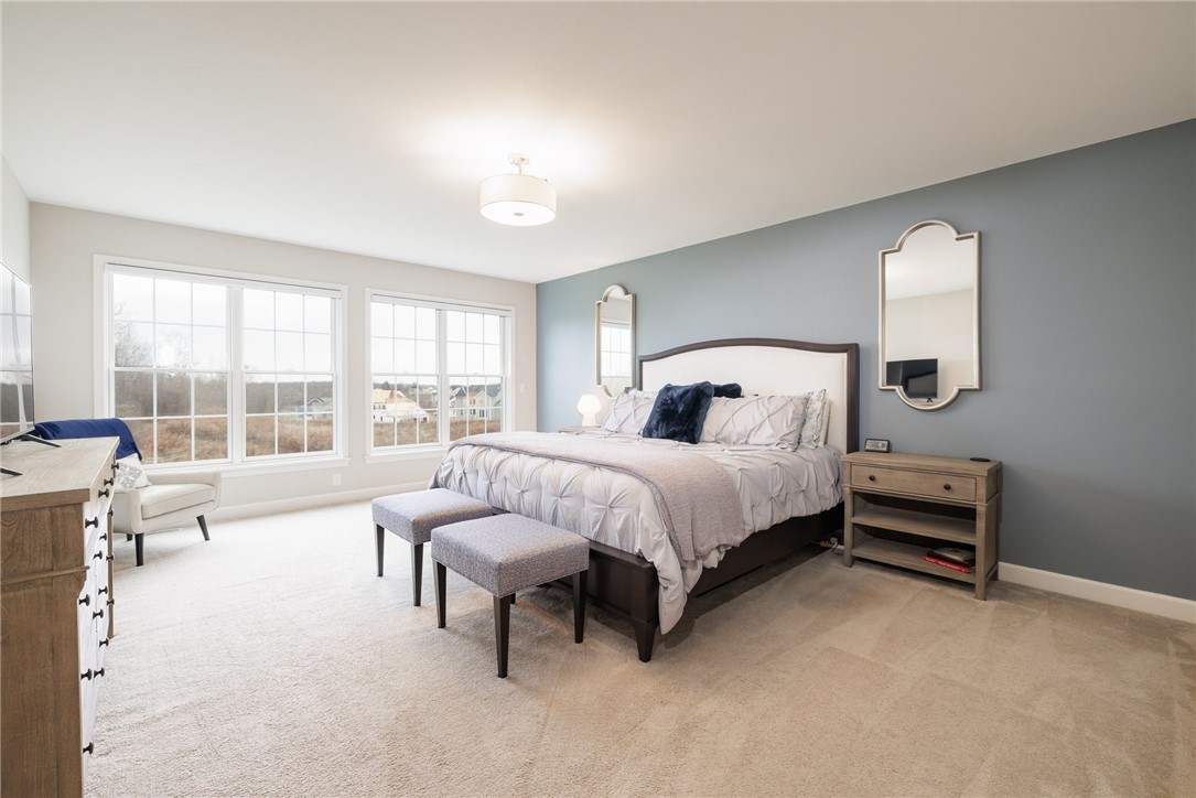 83 Coventry Ridge Pittsford, NY 14534 - Photo 23 of 50 Primary bedroom. 2 California designed walk-in clo