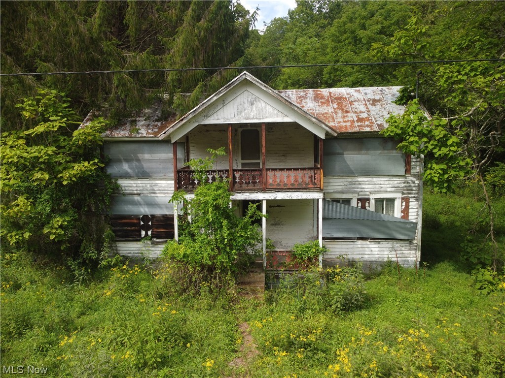 1671 Back Fork Road Big Springs, WV 26137 - Photo 1 of 19 View of front of house with balcony