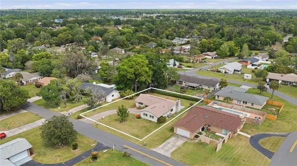 an aerial view of a house with a garden