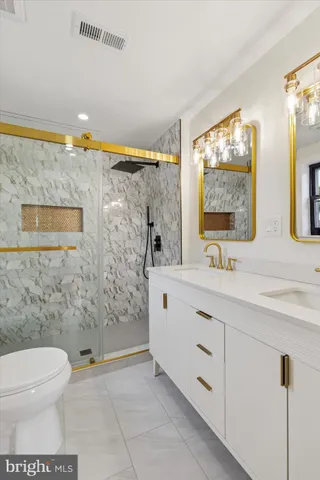 a bathroom with a sink a mirror and shower