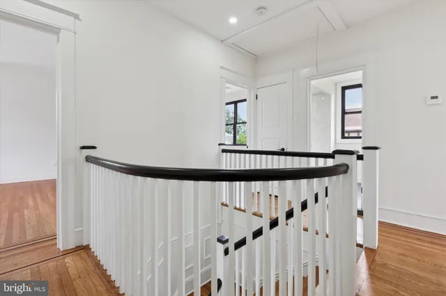 a bathroom with a white toilet and a bathtub