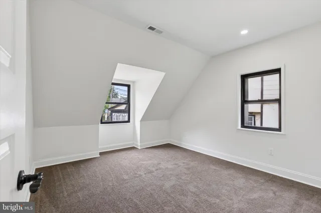 a view of a hallway with washer and dryer