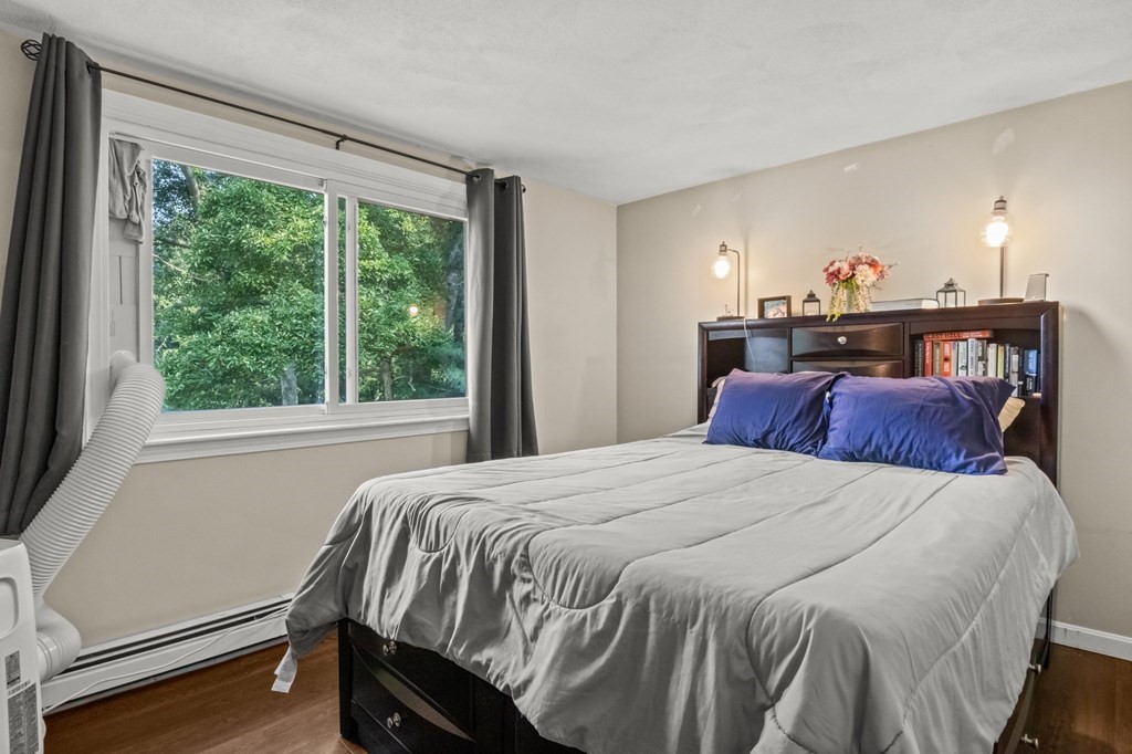 61 Thom Avenue Bourne, MA 02532 - Photo 14 of 32 a bedroom with a bed and a window
