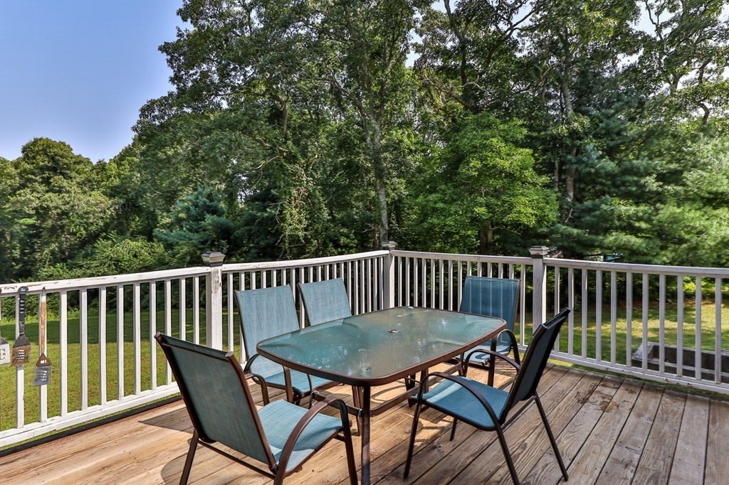 61 Thom Avenue Bourne, MA 02532 - Photo 26 of 32 a view of a chair in wooden deck