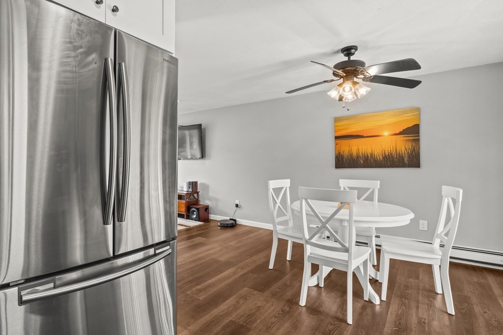 61 Thom Avenue Bourne, MA 02532 - Photo 5 of 32 a view of a dining room with furniture window and wooden floor