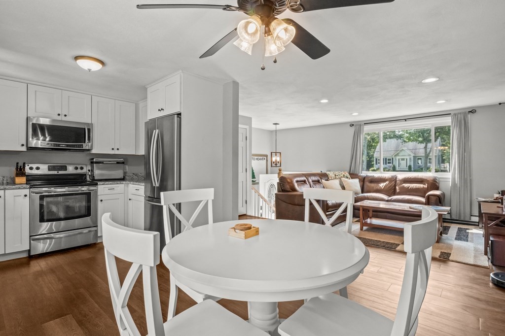 61 Thom Avenue Bourne, MA 02532 - Photo 7 of 32 a living room with stainless steel appliances furniture a flat screen tv and kitchen view