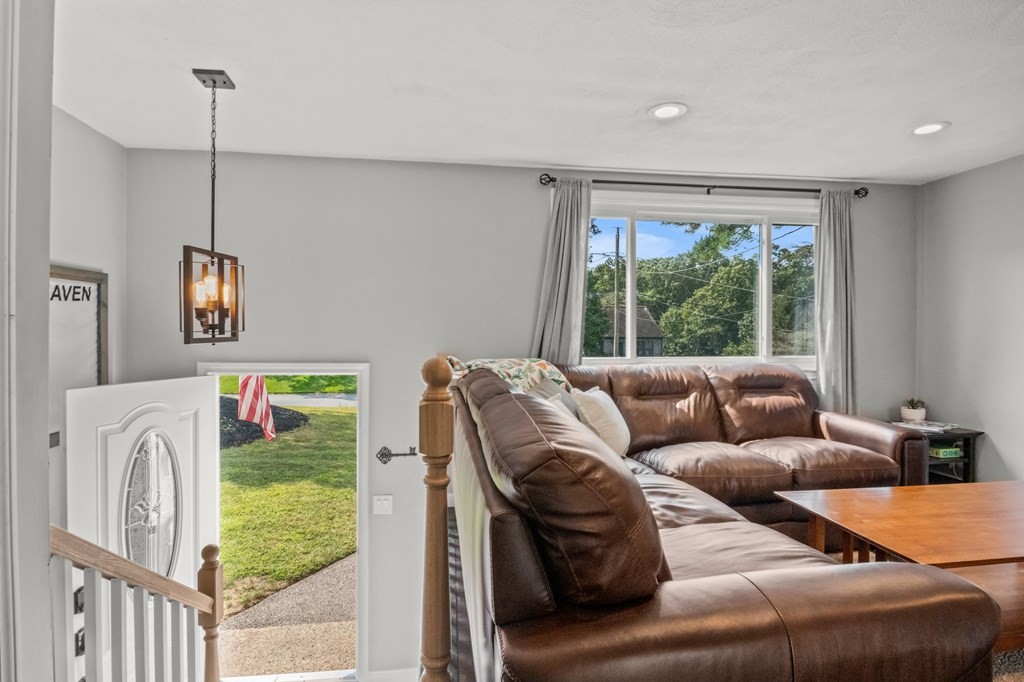 61 Thom Avenue Bourne, MA 02532 - Photo 10 of 32 a living room with furniture and a window