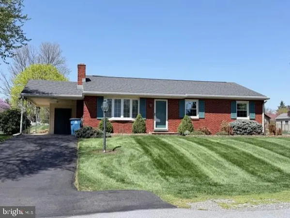 a front view of a house with table and chairs