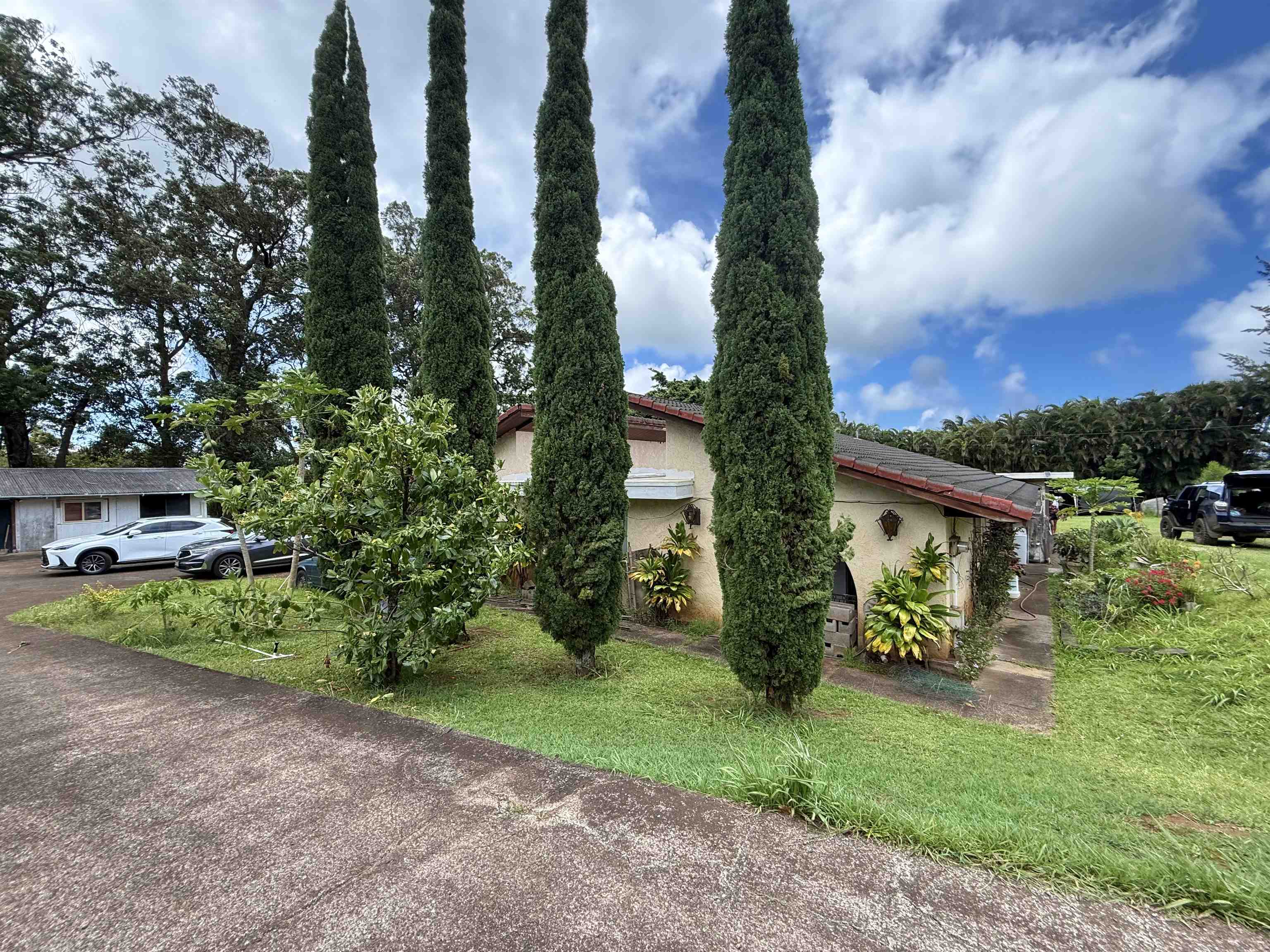 a front view of a house with garden