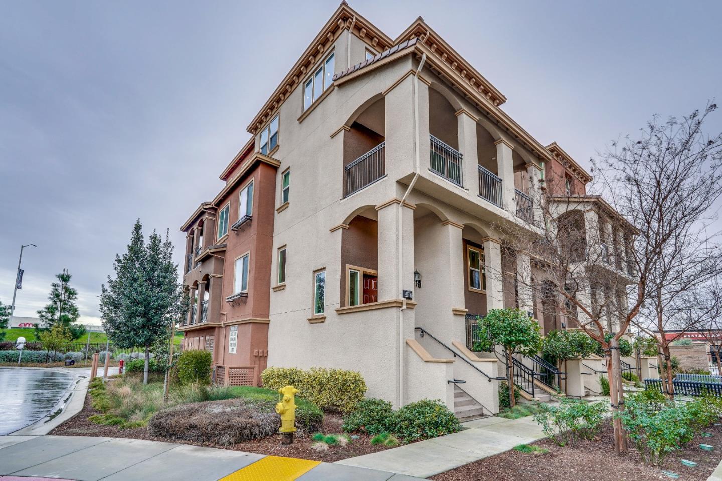 a front view of a residential houses with yard