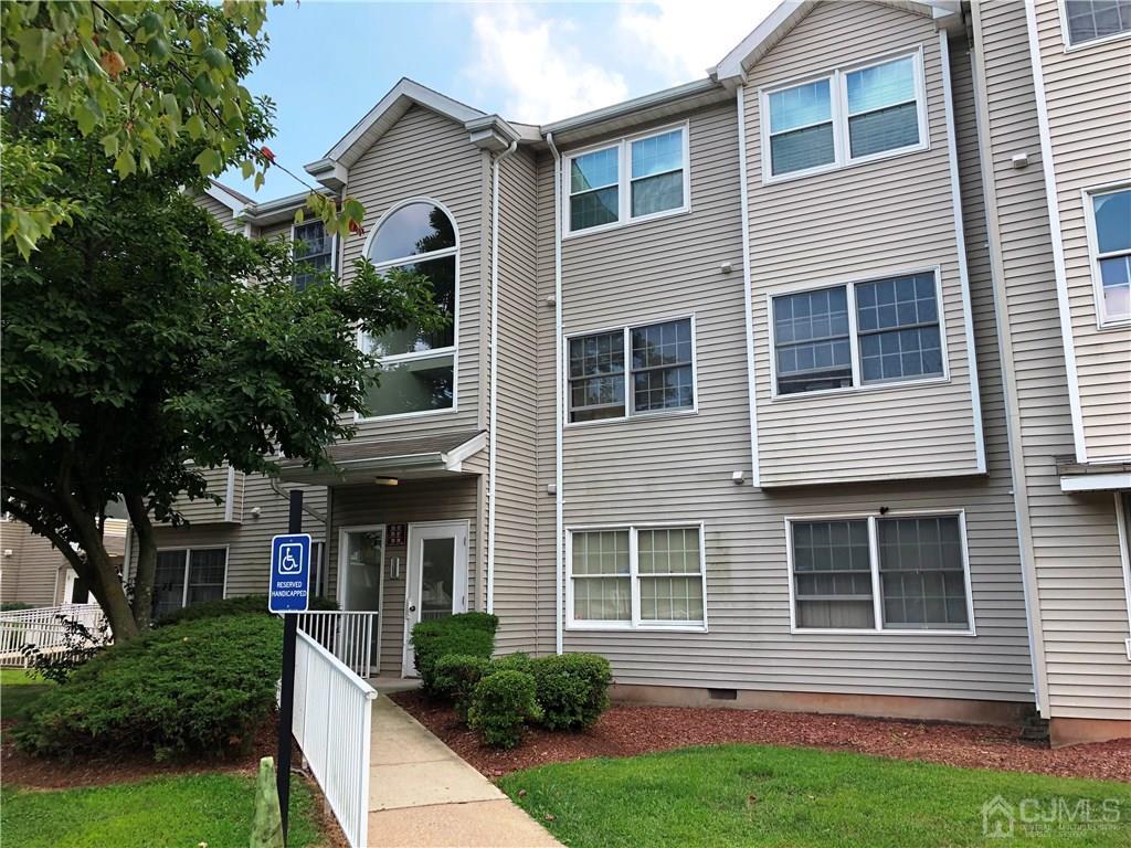 1237 Edpas Road, Unit 1237 New Brunswick, NJ 08901 - Photo 1 of 29 a front view of a house with garden
