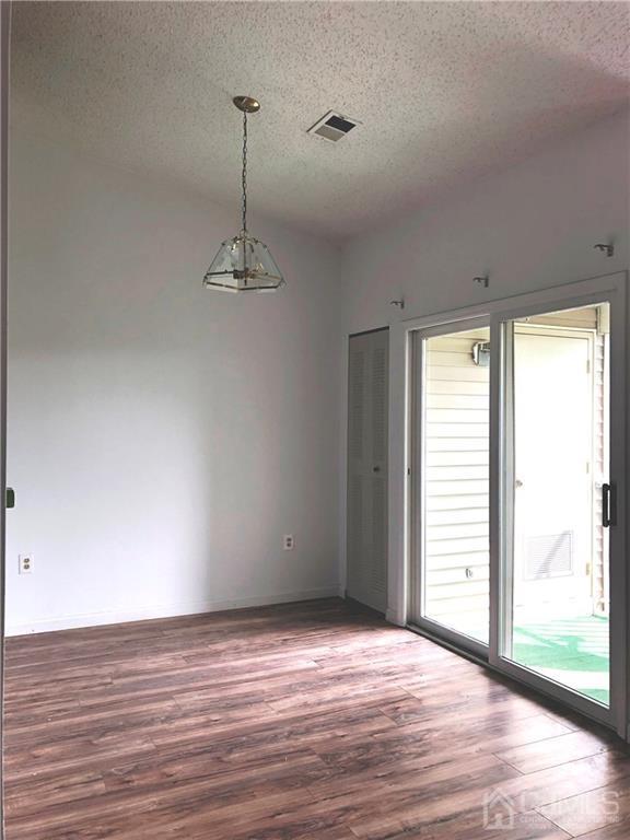 1237 Edpas Road, Unit 1237 New Brunswick, NJ 08901 - Photo 12 of 29 a view of a room with wooden floor and a window