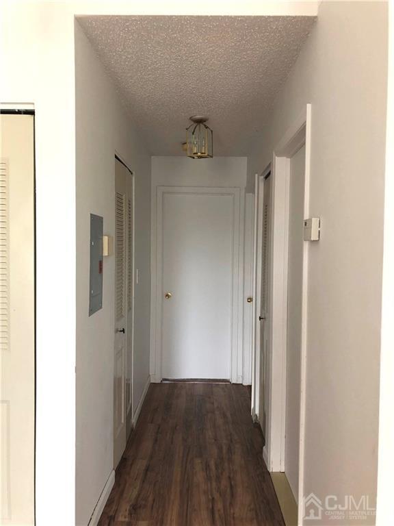 1237 Edpas Road, Unit 1237 New Brunswick, NJ 08901 - Photo 13 of 29 a view of a hallway with wooden floor