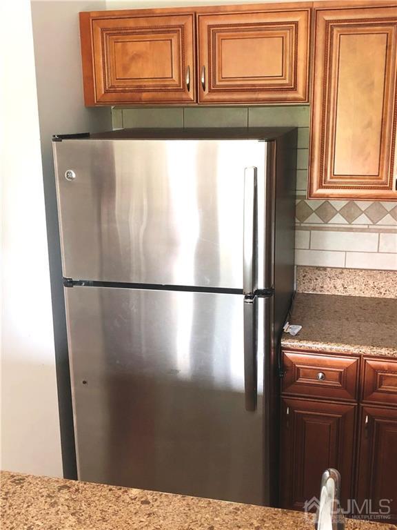 1237 Edpas Road, Unit 1237 New Brunswick, NJ 08901 - Photo 18 of 29 a close view of a refrigerator in kitchen