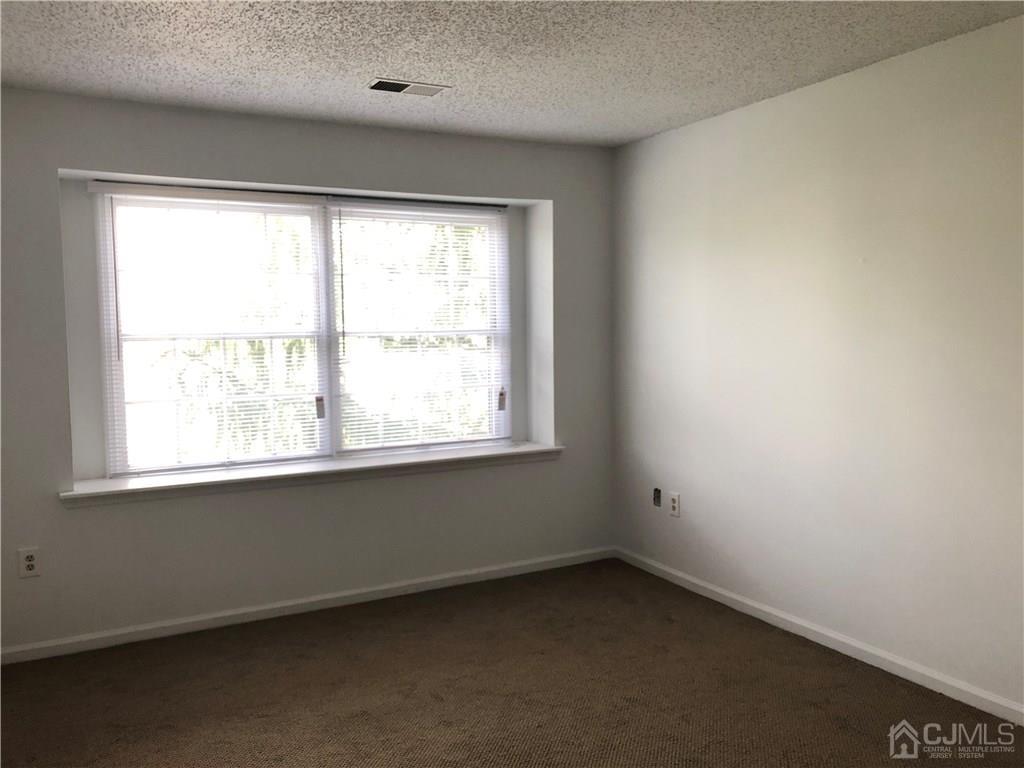 1237 Edpas Road, Unit 1237 New Brunswick, NJ 08901 - Photo 25 of 29 an empty room with a window