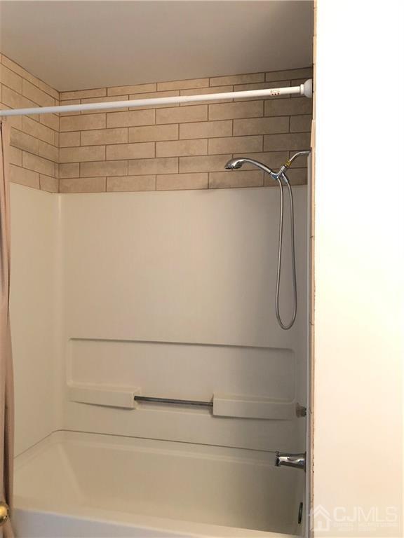 1237 Edpas Road, Unit 1237 New Brunswick, NJ 08901 - Photo 28 of 29 a close up of a shower
