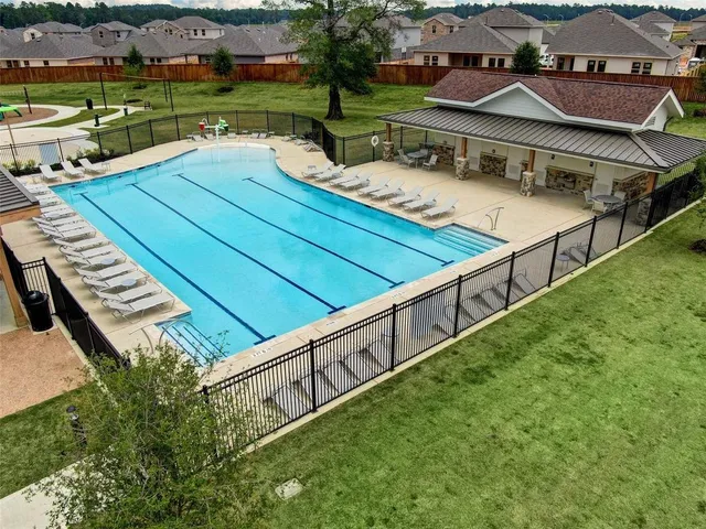 an aerial view of a house with deck and patio