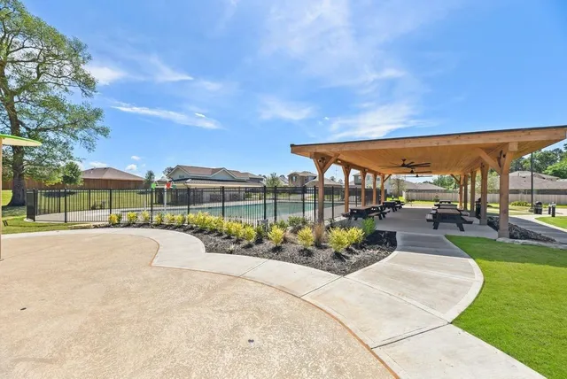 a view of a swimming pool with a patio