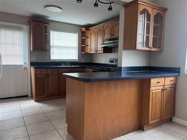 a large living room with a fireplace