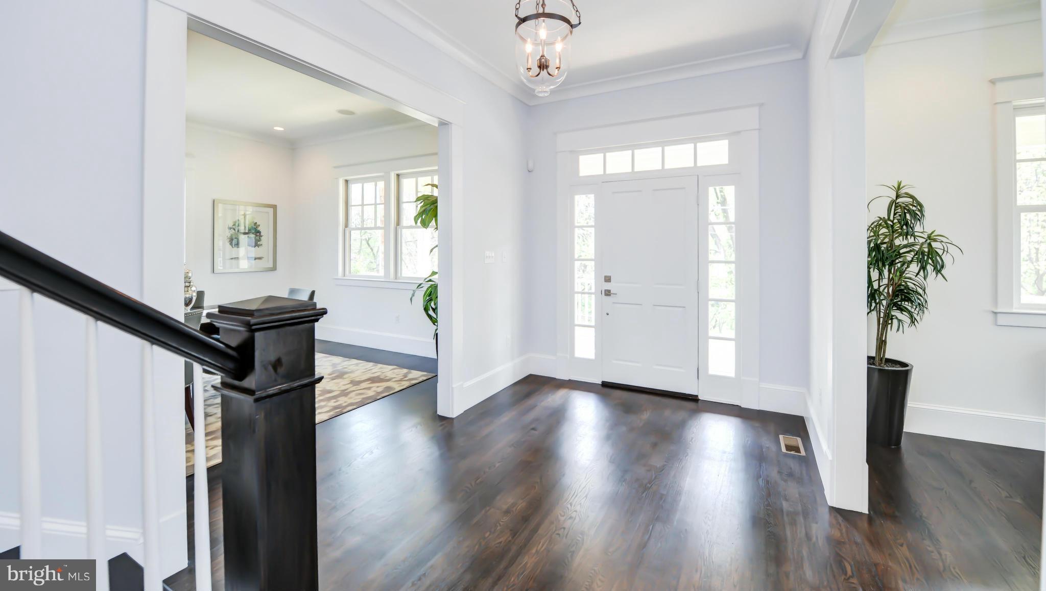 2735 Lorcom Lane Arlington, VA 22207 - Photo 2 of 30 a view of a hallway with wooden floor and stairs
