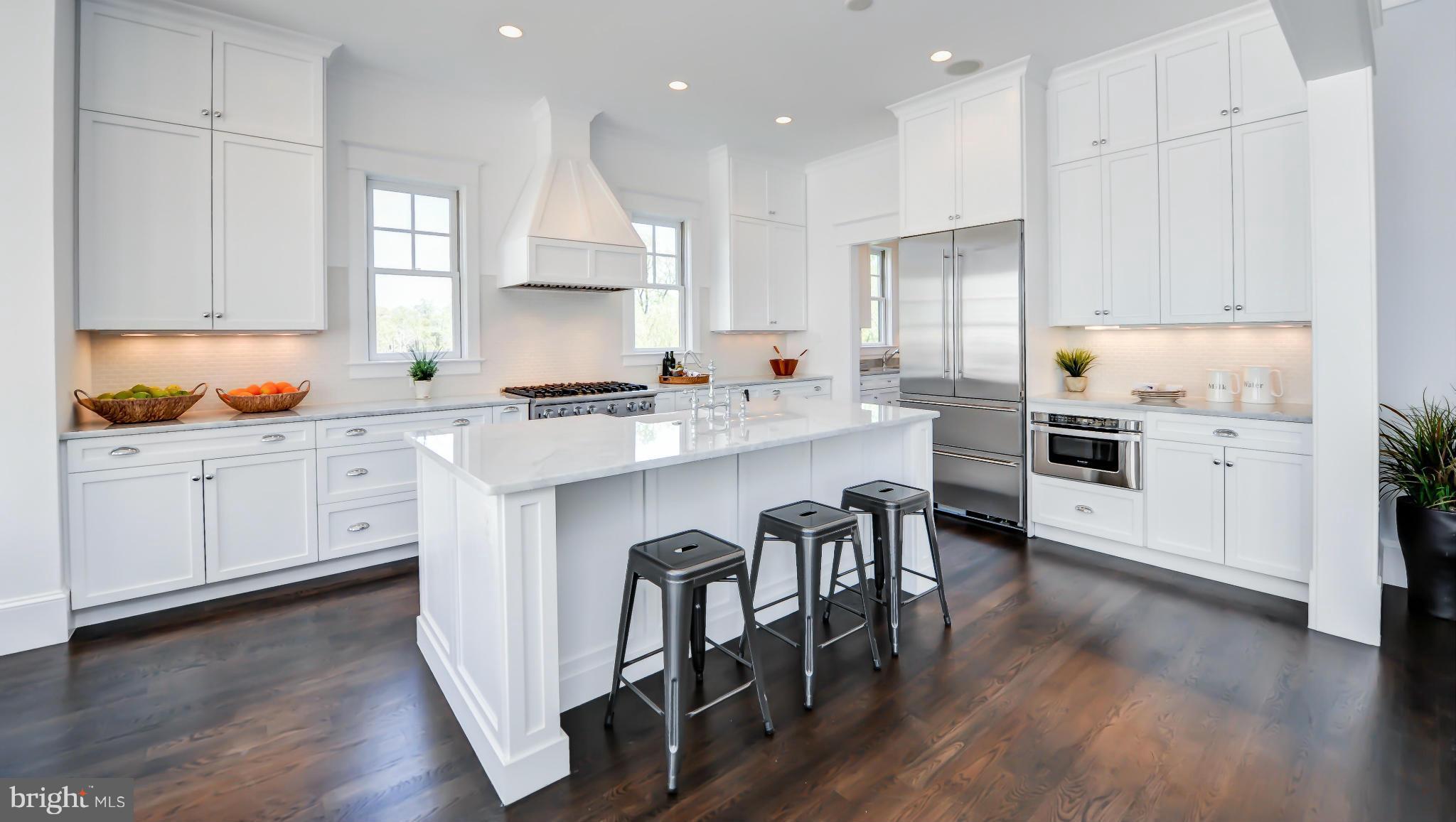 2735 Lorcom Lane Arlington, VA 22207 - Photo 13 of 30 a kitchen with a sink a cabinets and wooden floor