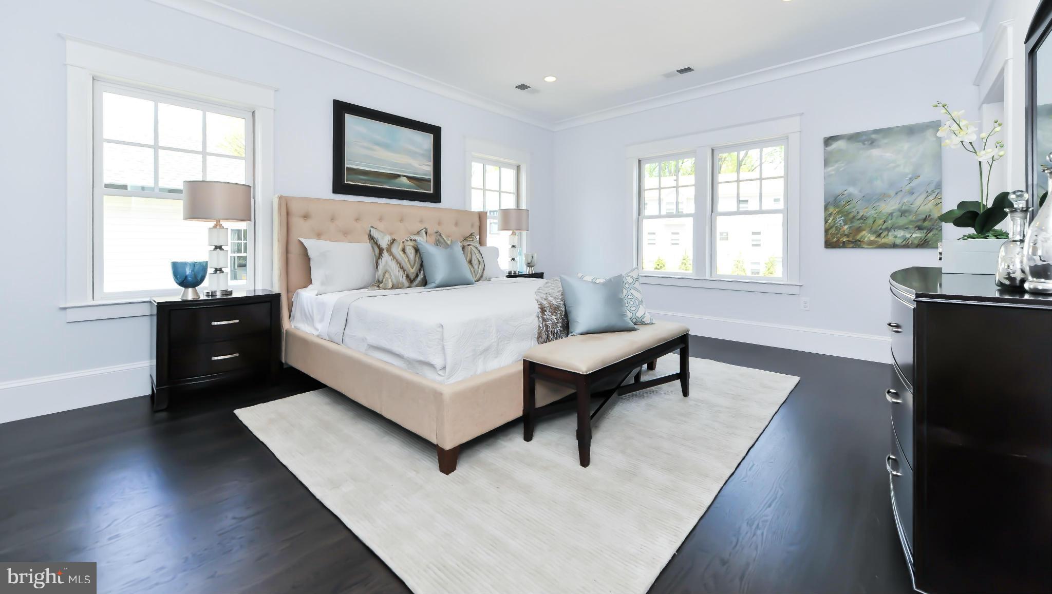 2735 Lorcom Lane Arlington, VA 22207 - Photo 16 of 30 a spacious bedroom with a bed and wooden floor