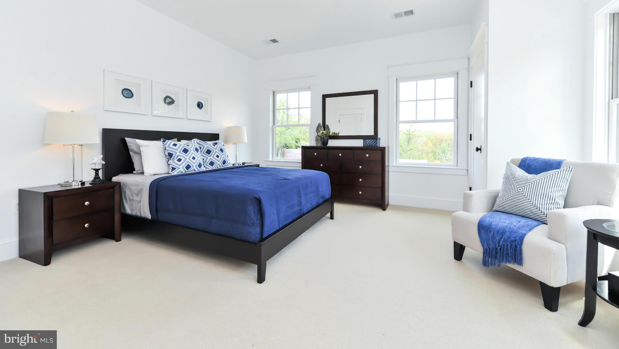 2735 Lorcom Lane Arlington, VA 22207 - Photo 20 of 30 a spacious bedroom with a bed and a window