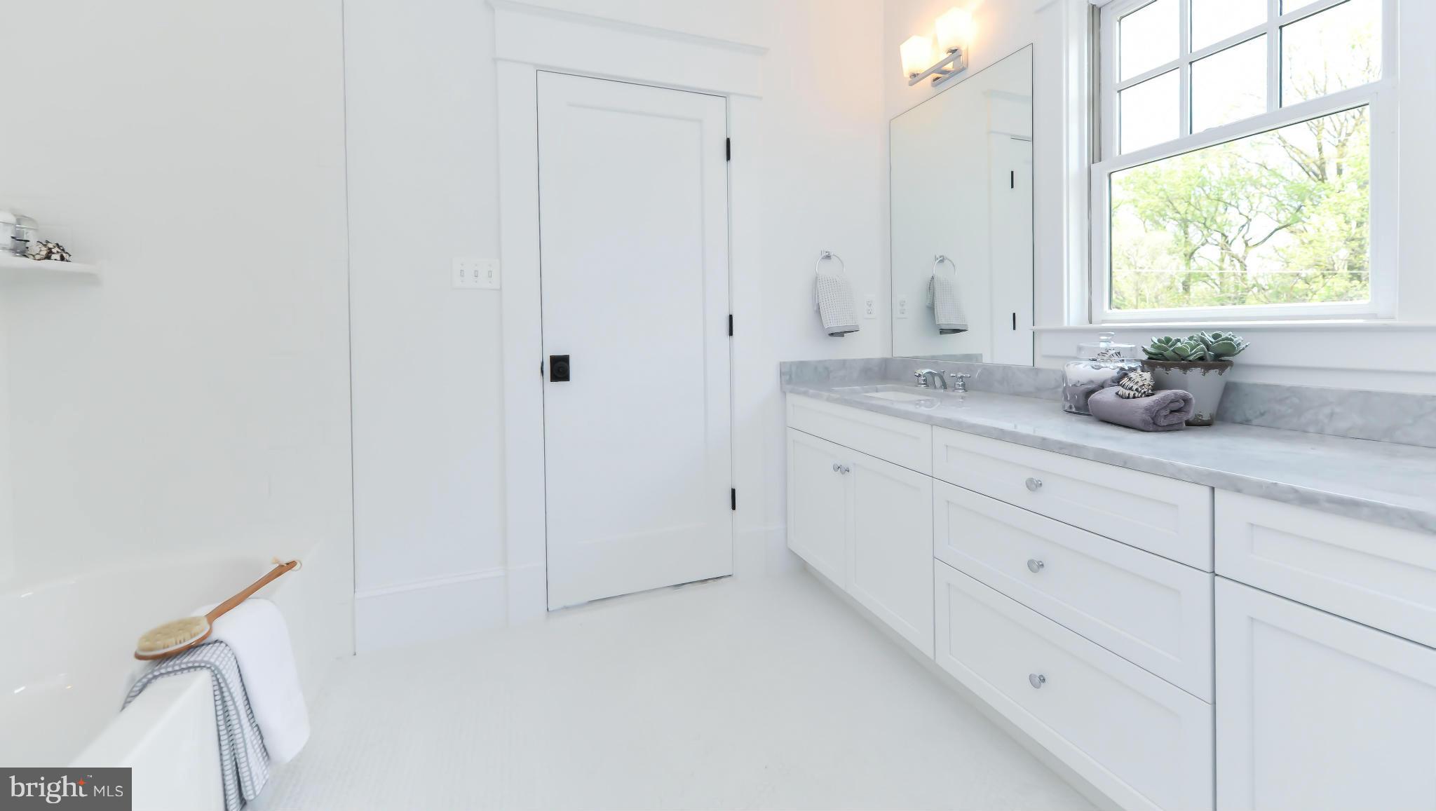 2735 Lorcom Lane Arlington, VA 22207 - Photo 21 of 30 a bathroom with a granite countertop sink and a mirror