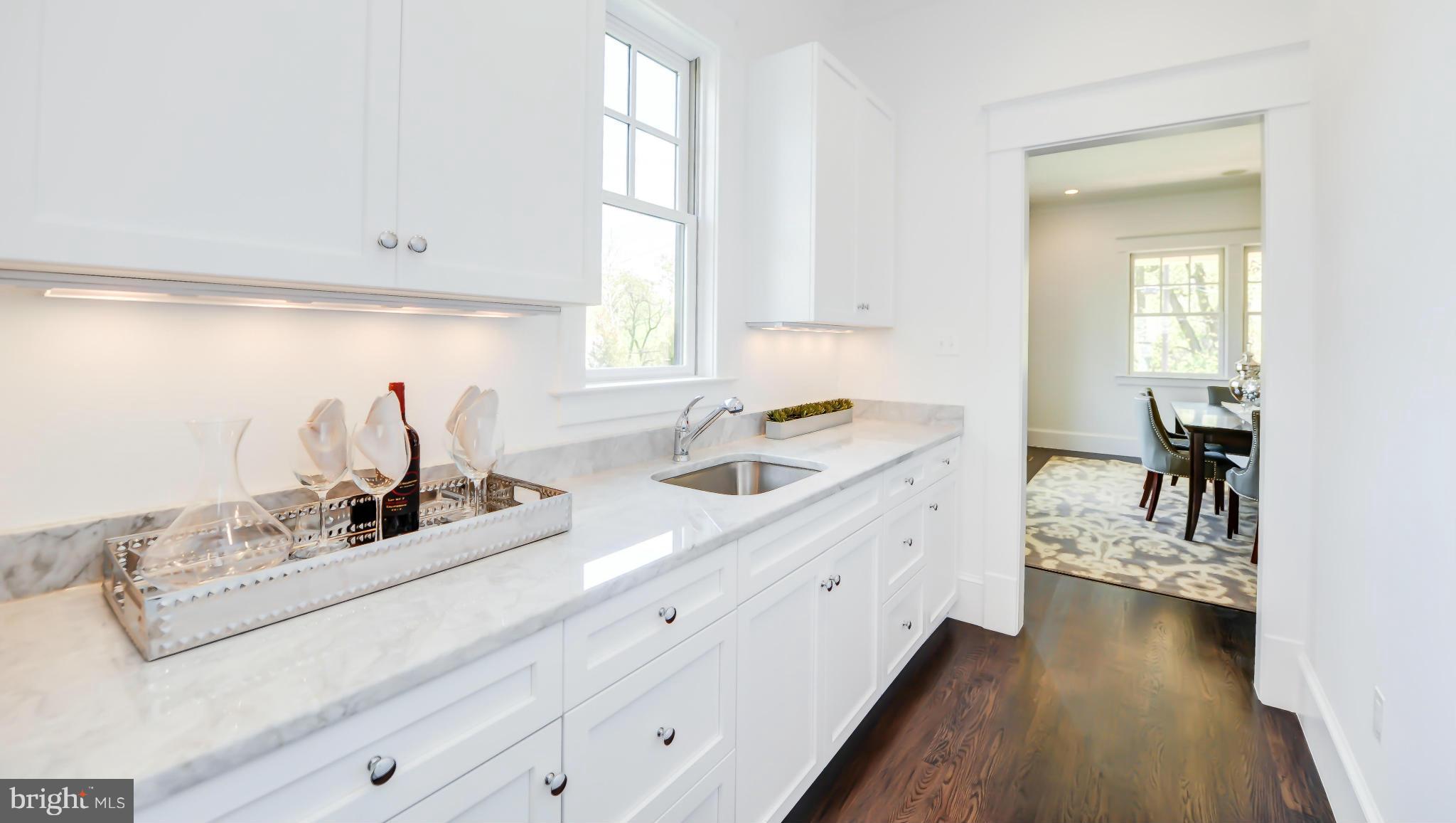 2735 Lorcom Lane Arlington, VA 22207 - Photo 8 of 30 a kitchen with sink cabinets and window