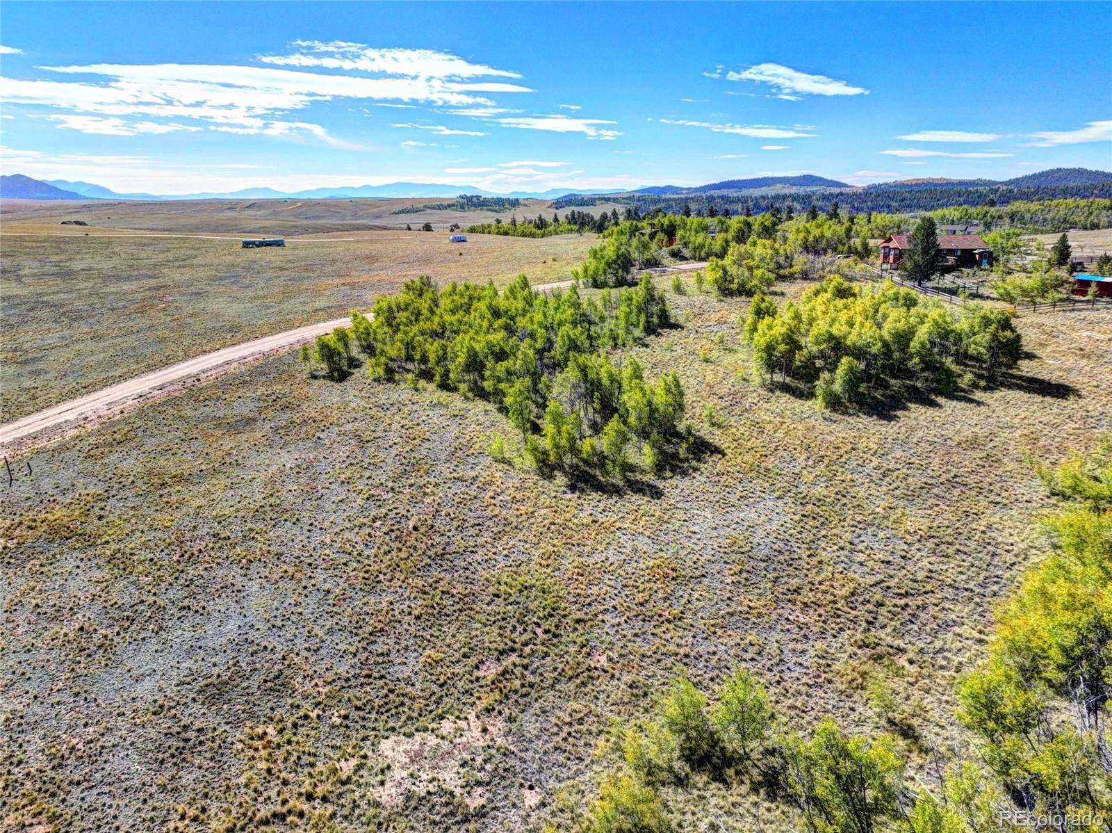225 Antelope Way Como, CO 80432 - Photo 17 of 20 a view of a large body of water with lots of bushes