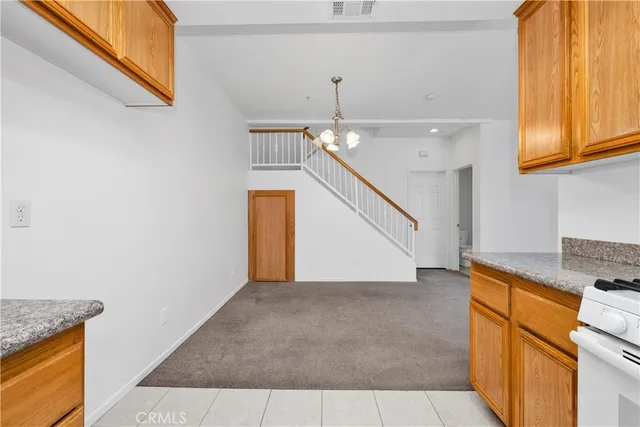 a view of a kitchen with a sink and cabinets