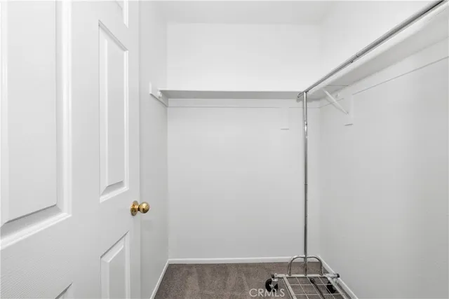 a view of a hallway with closet