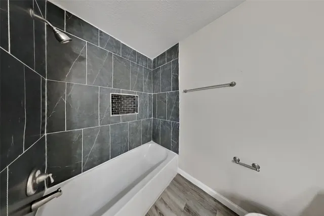 a bathroom with a sink and shower