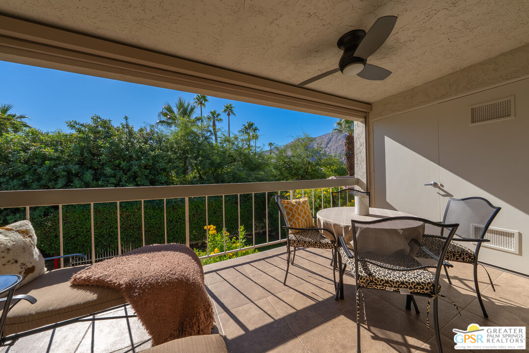325 East Via Escuela, Unit 324 Palm Springs, CA 92262 - Photo 22 of 29 a view of a balcony with furniture