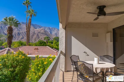 a view of a balcony with furniture