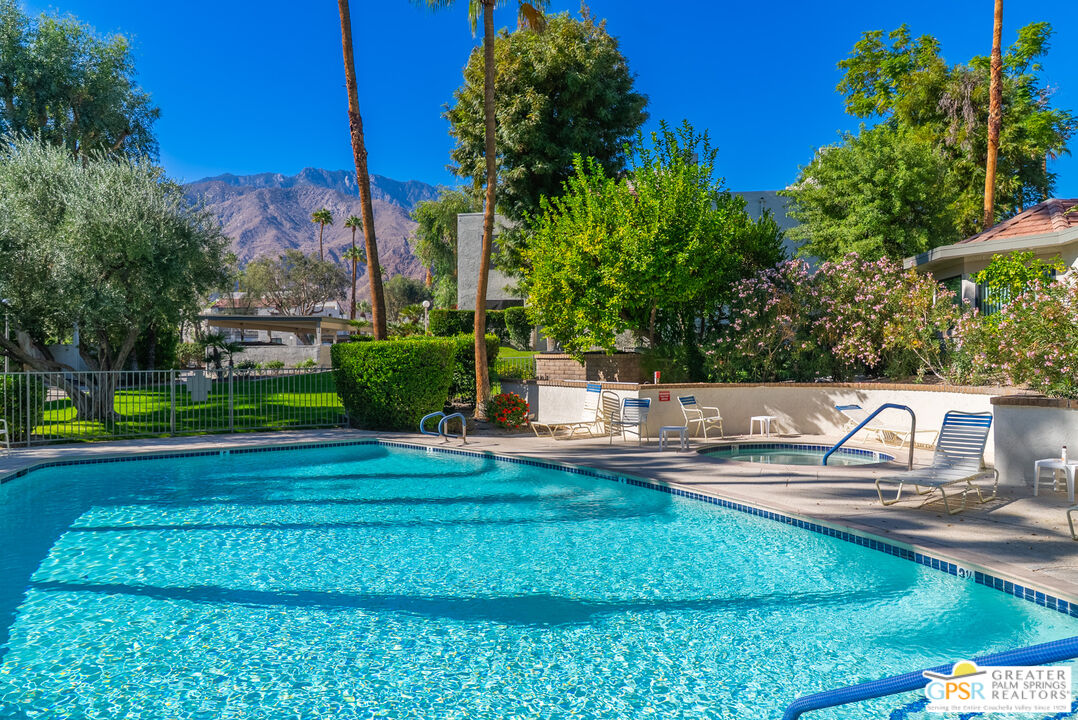 325 East Via Escuela, Unit 324 Palm Springs, CA 92262 - Photo 26 of 29 a view of a house with a yard