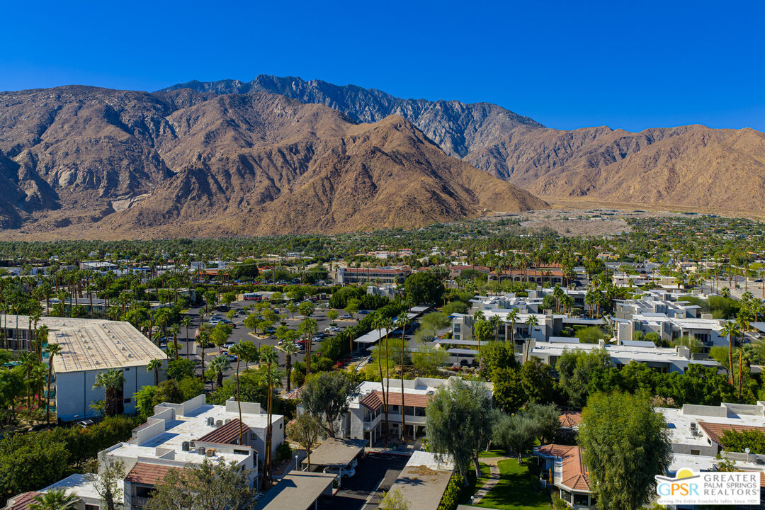 325 East Via Escuela, Unit 324 Palm Springs, CA 92262 - Photo 28 of 29 an aerial view of multiple house
