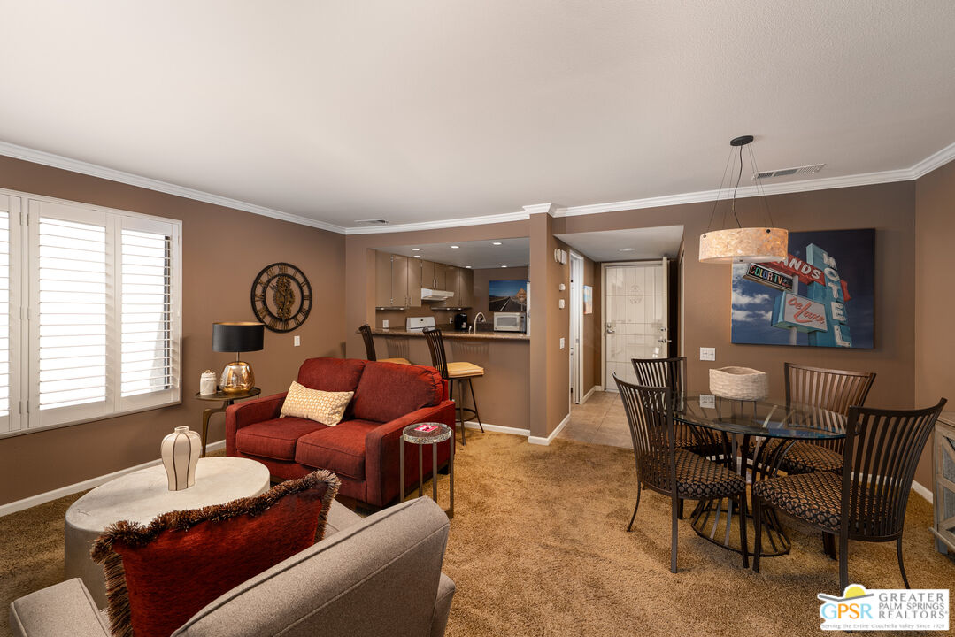 325 East Via Escuela, Unit 324 Palm Springs, CA 92262 - Photo 5 of 29 a living room with furniture and a window