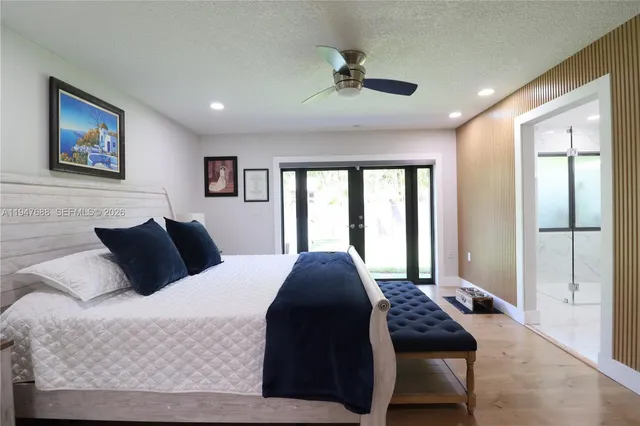 a bedroom with a large bed and a window