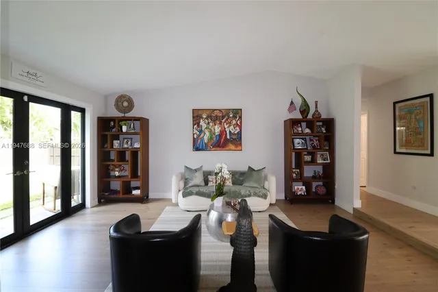 a living room with furniture window and wooden floor