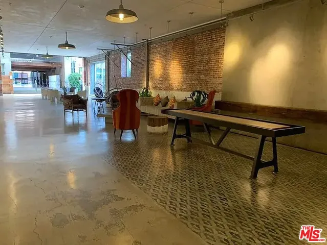 a living room with lots of furniture and a wooden floor