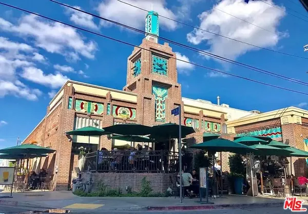 a view of a cafe with sitting area