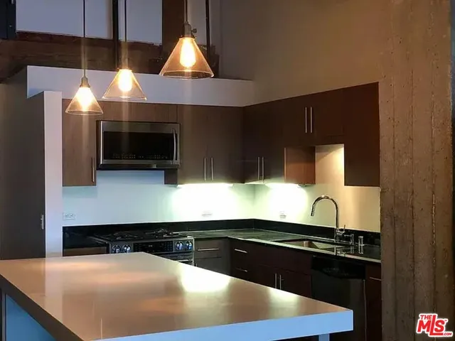 a kitchen with a stove and a microwave