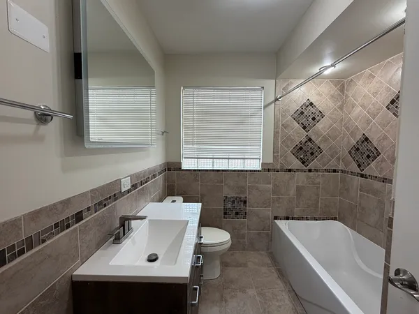 a bathroom with a sink and a bathtub