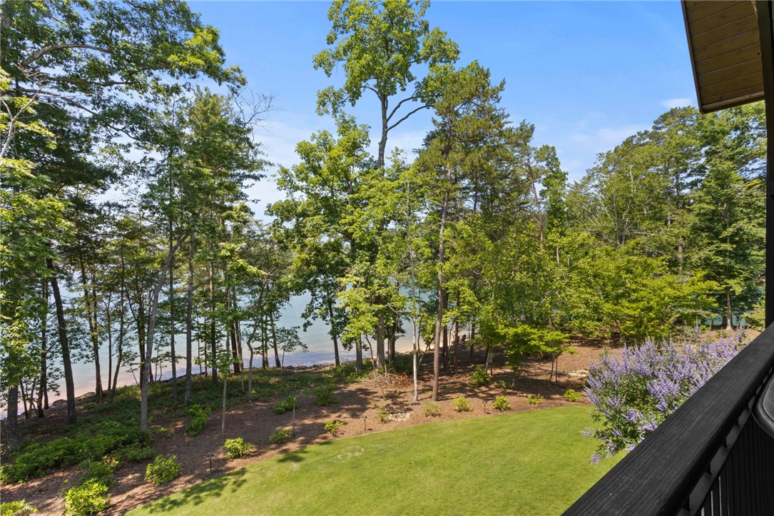 236 Palmer Way Sunset, SC 29685 - Photo 29 of 46 A tranquil lakefront setting offers a private yard surrounded by natural landscaping and mature trees.